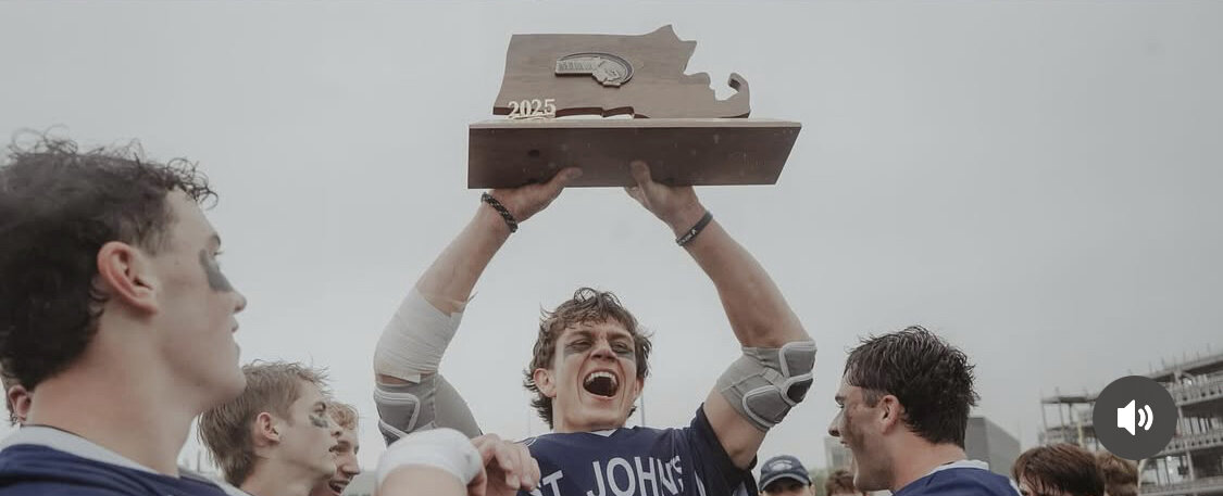 Chuck Angell raising the 2025 MIAA D1 Massachusetts state championship trophy with St. John's Prep